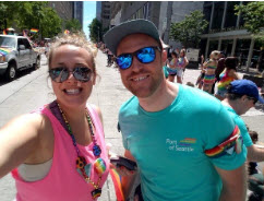 Jesse Zirwes with a friend at a pride parade.