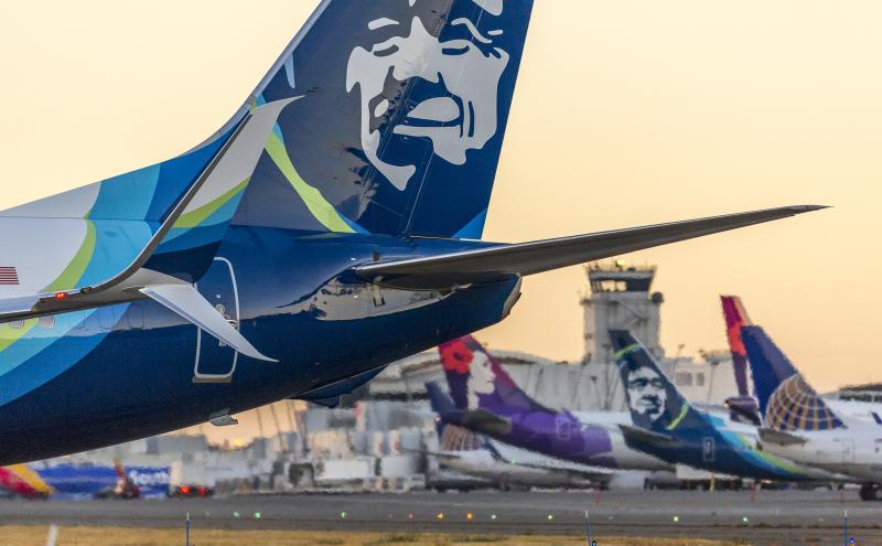 End of plane wings at tarmac