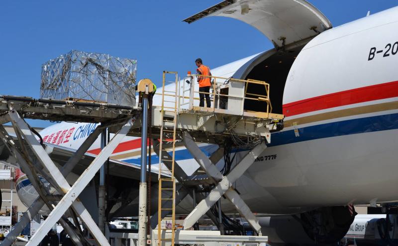 An airplane being loaded with cargo.