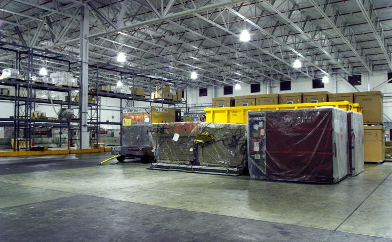 Cargo containers inside of a warehouse.