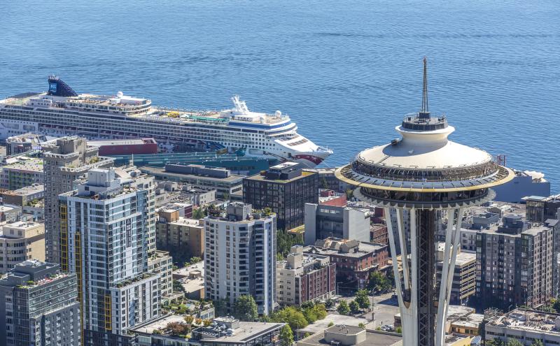Aerial image of Space Needle and cruise ship in background