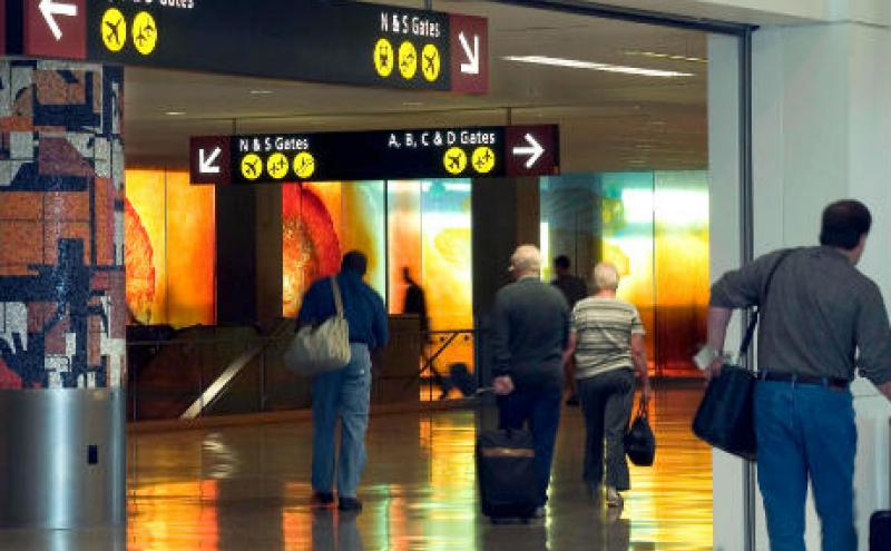 Passengers walking through the airport halls.