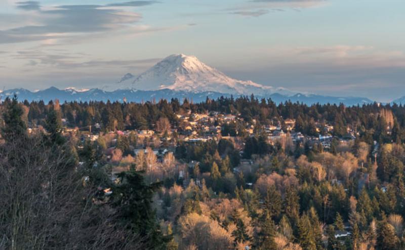 Aerial view of the community of SeaTac, Washington, with Mount Rainier in the background