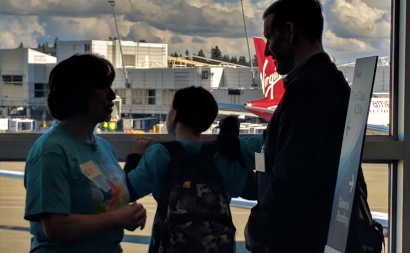 Autistic children practice at the airport.