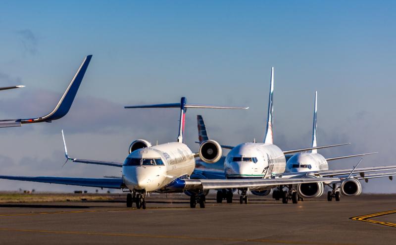 Planes await on the taxiway for takeoff at Sea-Tac Airport