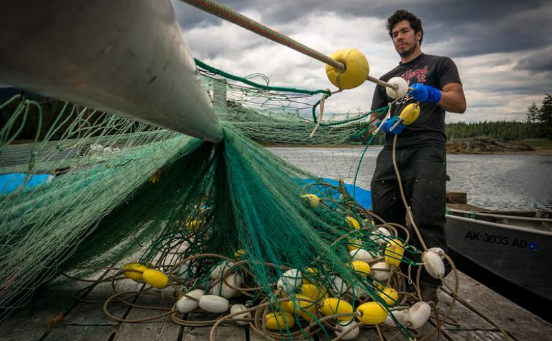 On boats like the Loki, spring prep before heading out to sea often entails repairing nets and other gear. (Photo courtesy of Graham McDowell)
