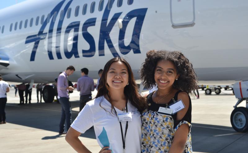 Two interns at a networking event at Sea-Tac airport.