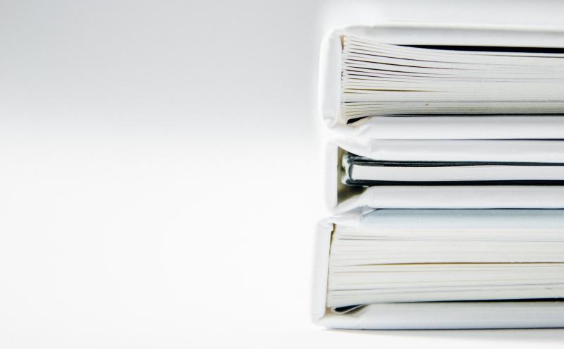 A stack of documents- decorative