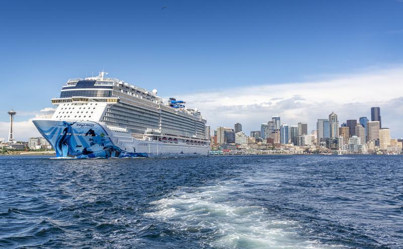 Bliss cruise ship with space needle in background.