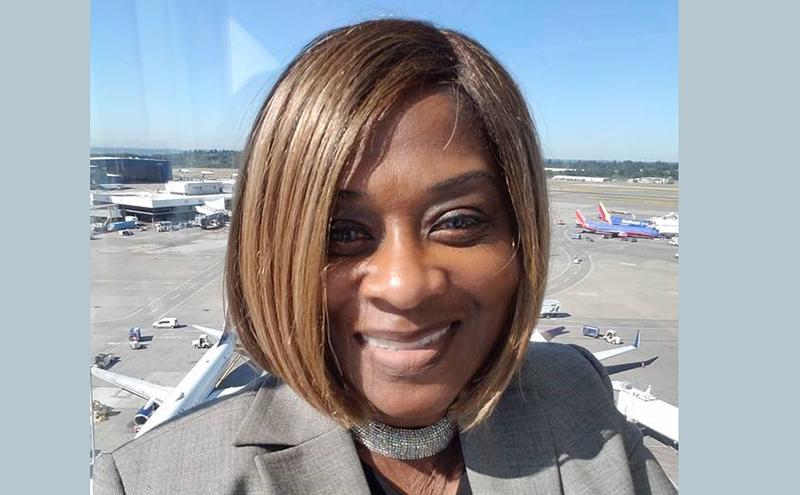 Patricia Ly with Airport runway in background
