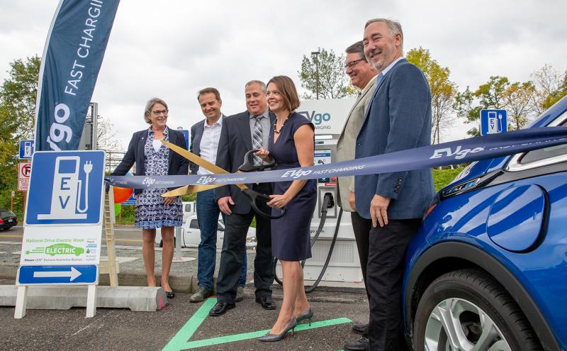Commissioner Courtney Gregoire is joined by leaders from WSDOT, EVgo, and Forth in a ribbon cutting ceremony for new EV charging stations at Sea-Tac Airport