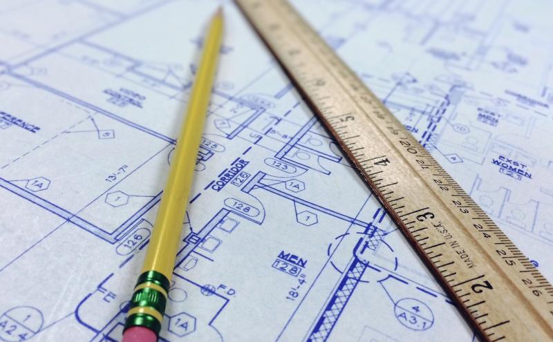 Pencil and ruler laying on a blueprint