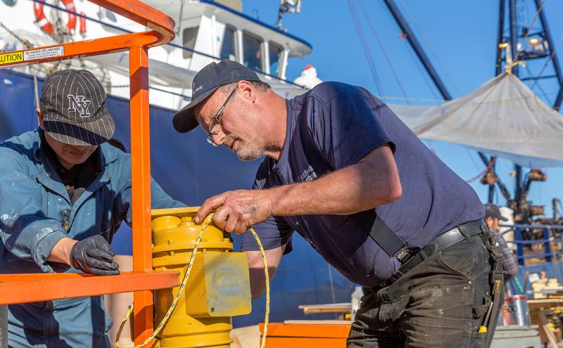 Men working at the Maritime Industrial Center shipyard on Salmon Bay, Seattle, October, 2016