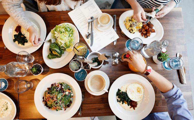 A table filled with plates of food.