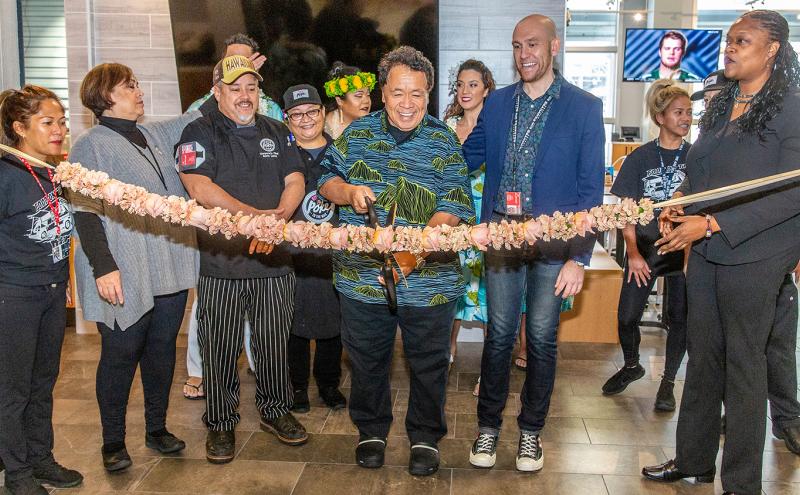 Owner Sam Choy, his staff, and SEA Leader Dawn Hunter cut the "lei" for a grand opening  of Poke to the Max at SEA, Dec. 13, 2019