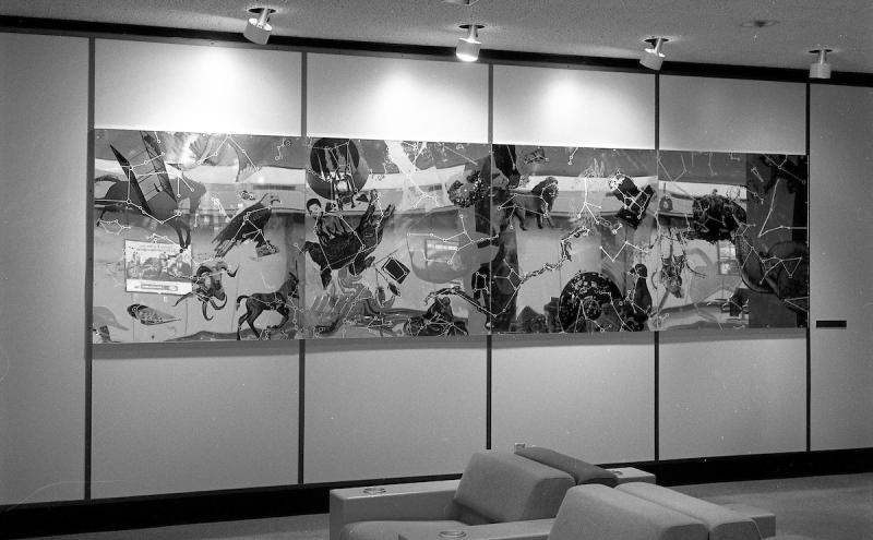 A wide horizontal panel silkscreened with overlapping animals and shapes connected by thing angular lines. 