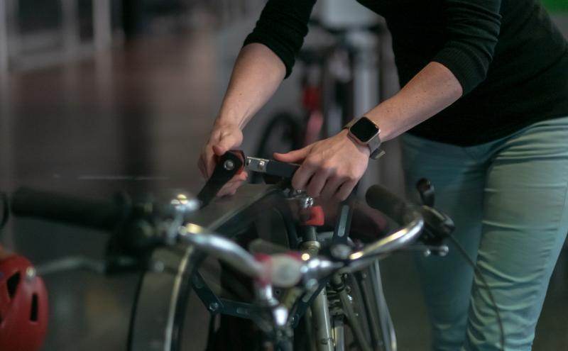 Traveler easily locking bike on the rack.
