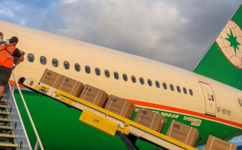 EVA Air jet loading cargo into passenger cabin.
