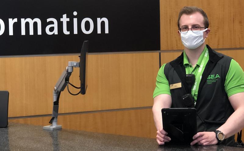 A SEA Airport pathfinder wears a face covering to help prevent the spread of the coronavirus.