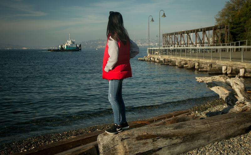 Visitor at Jack Block Park looking at the waterfront.