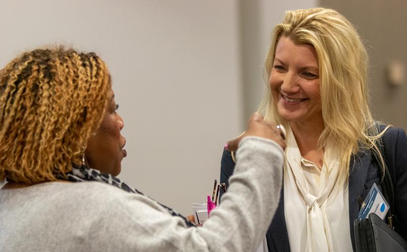 Two women converse at a Port Gen event for SWMBE contractors, Feb. 2020