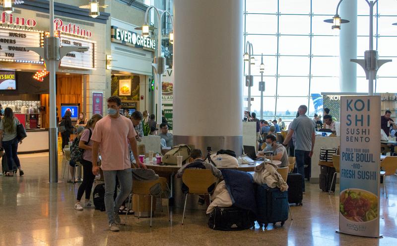 Central Terminal at SEA Airport ready to travel with face coverings, June 26, 2020
