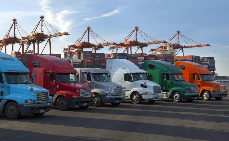 Trucks at a shipping yard.