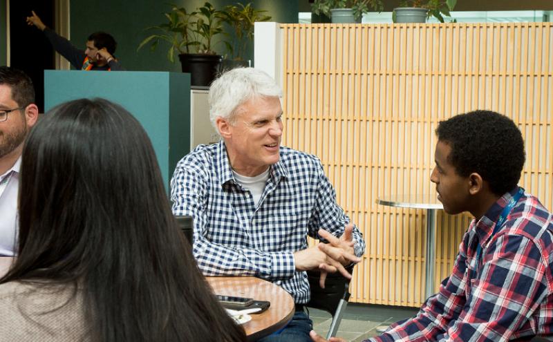Dave Soike talking to an intern
