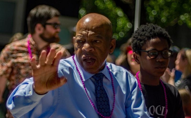 John Lewis waving in a parade.