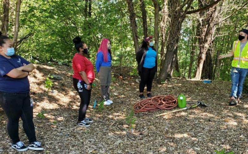 Opportunity initiative students work at a park