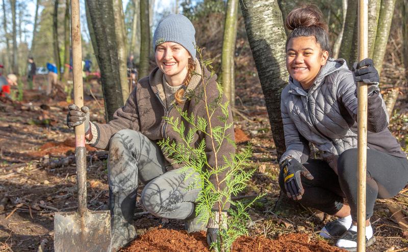 Two volunteers planting trees in the South Puget Sound area, Jan. 2019