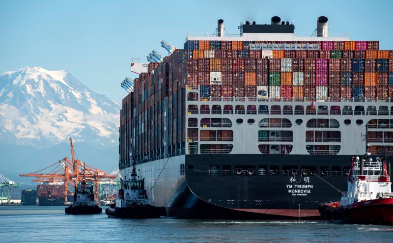 Cargo ship with Mount Rainier in the background.
