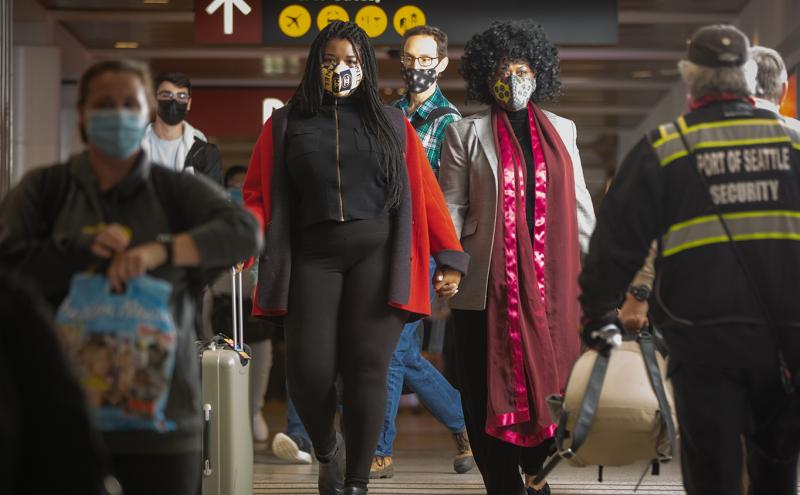Masked Passengers Walking in the Terminal at SEA