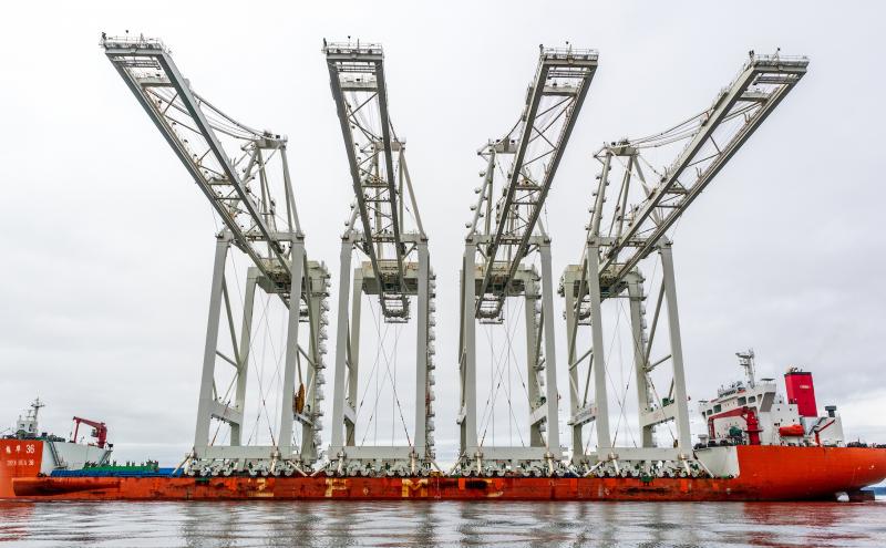 Looking up at four Super Post-Panamax Cranes arrive by ship enroute to Terminal 5