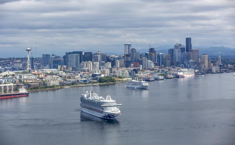 Cruise ship leaving the Port of Seattle with the city skyline in the background. 