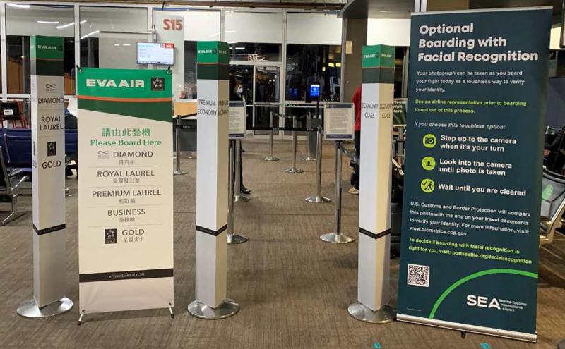 EVA passengers see an alert about optional facial recognition application boarding their flights at SEA Airport July 2021