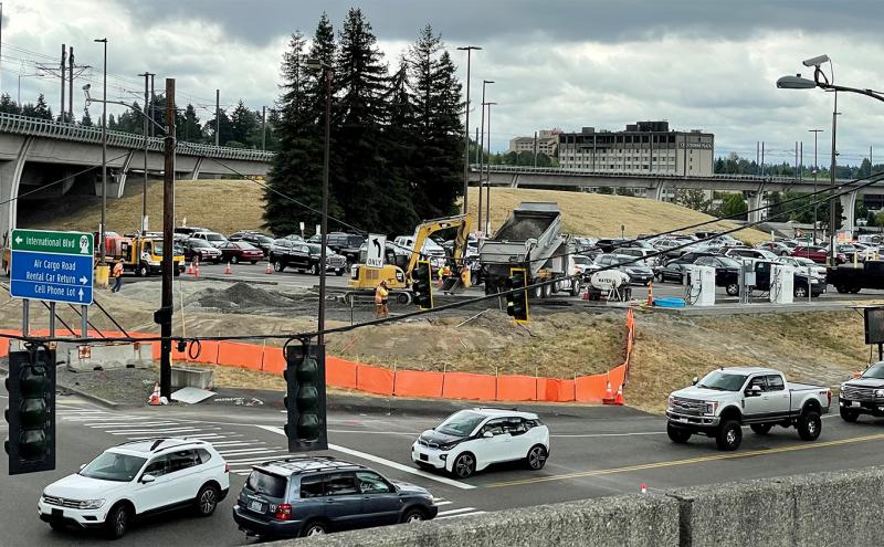 Cell Phone lot with dump trucks and workers beginning to make needed improvements July 2021