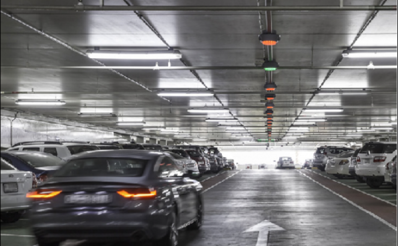 A car driving through a parking garage.