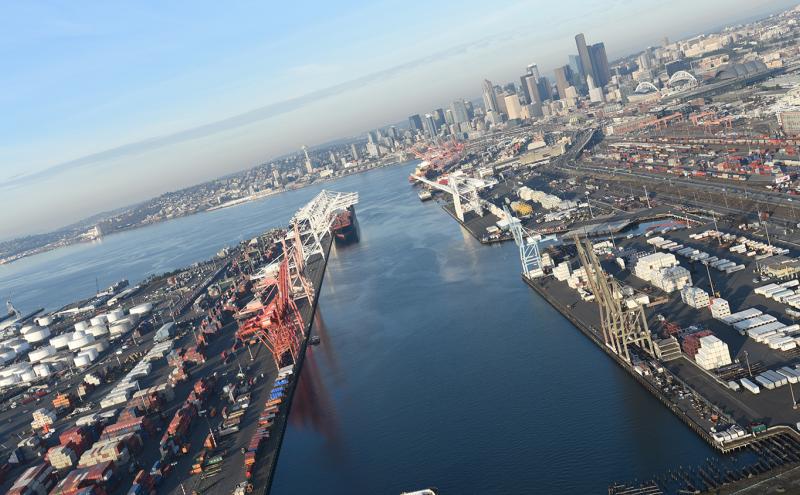 Aerial view of East Waterway container terminals and downtown Seattle skyline in the distance