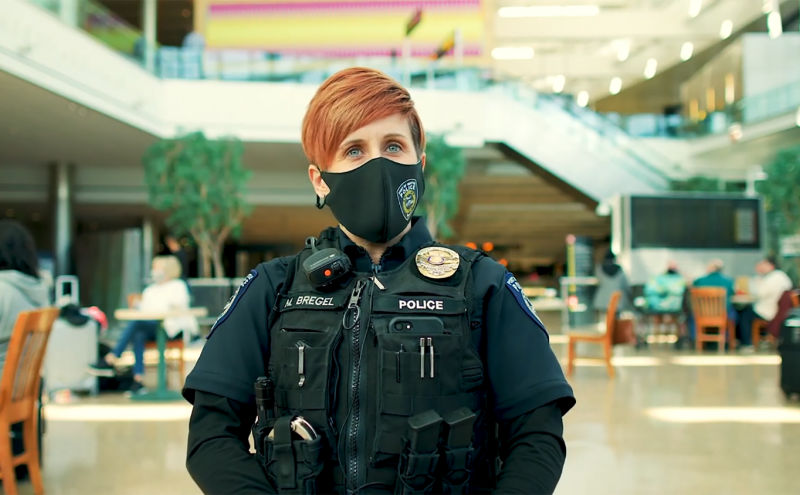 Officer Michelle Bregel, Crisis Coordinator at the Port of Seattle, assists customers.