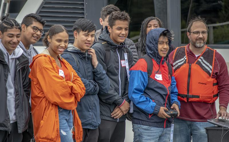 Mixed group of students learn the ropes at Fishermens Terminal from a Port employee 2019
