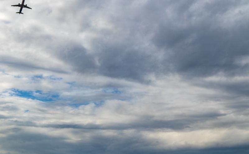 Plane in the cloudy sky