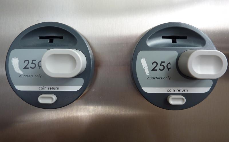 Feminine Hygiene dispenser with products costing 25 cents each.
