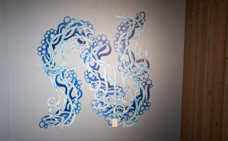 A full view of the second wall panel showing flowing blue serpentine. 