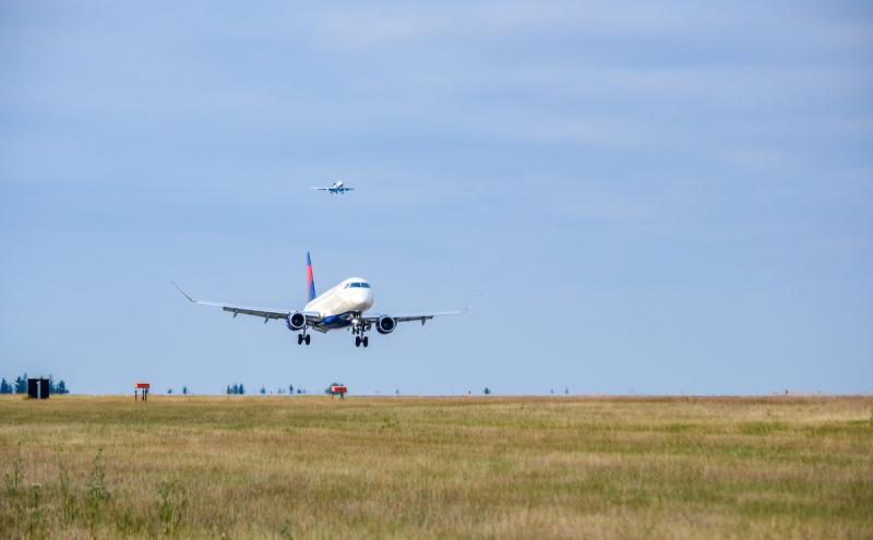 Aircraft taking off the runway.