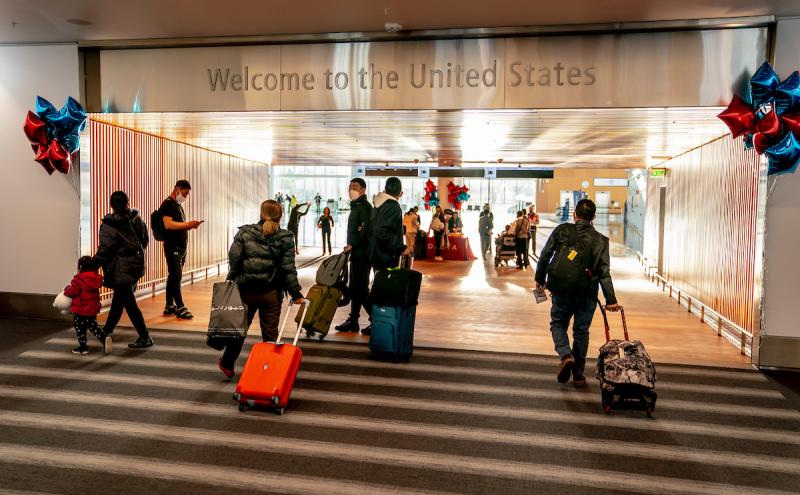 Passengers walking through the welcome portal
