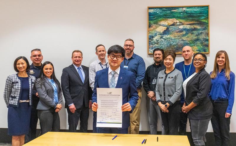 Port of Seattle Commissioners and staff present the Port Allies Against Human Trafficking (PAAHT) pledge