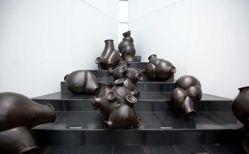 A view of just clunkers on the floor black clouds on a stair case like formation 
