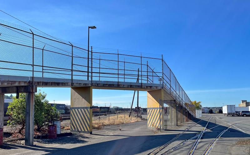 The existing T-91 Trail bridge over the rail crossing