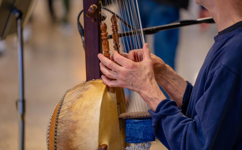 A close up of Chet Corpt's hands playing the Kora at Sub Pop.